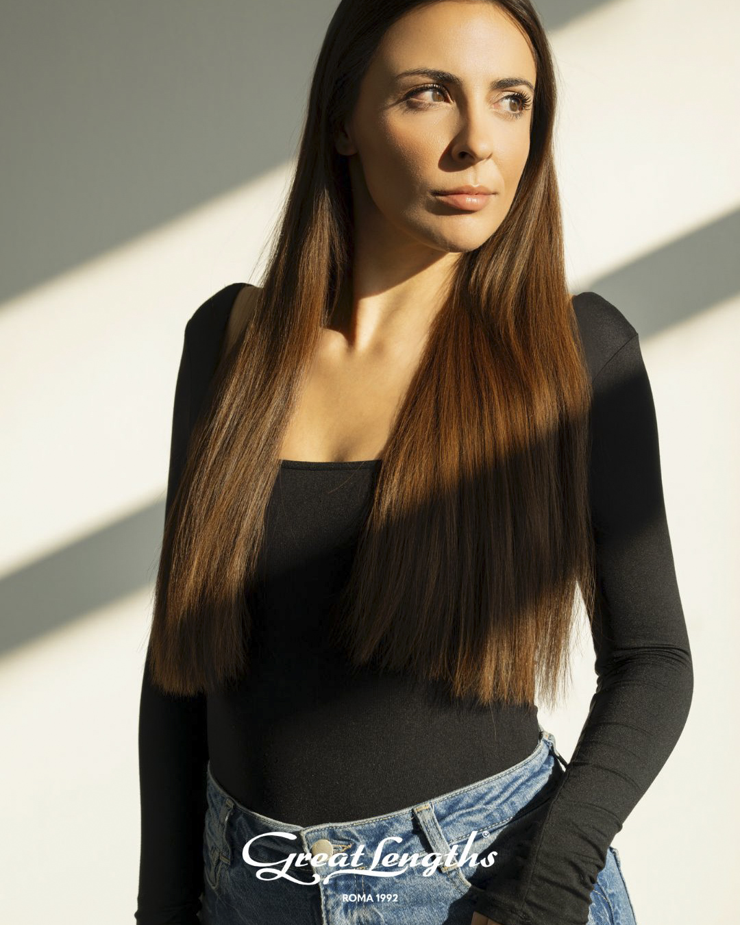 Frau mit langem Haar nach einer Haarverlängerung mit Great Lengths